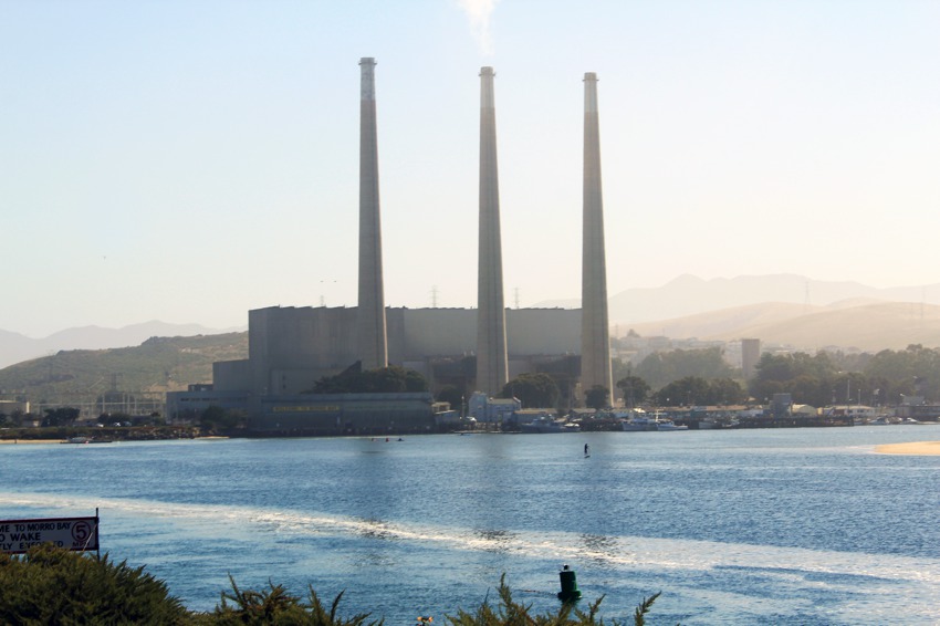 Paddleboarder and smoke stacks morro bay