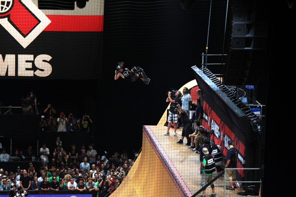 Sean White doing a grab X games Skatboard vert